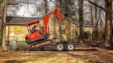 how to secure a mini excavator to a trailer|loading mini ex on trailer.